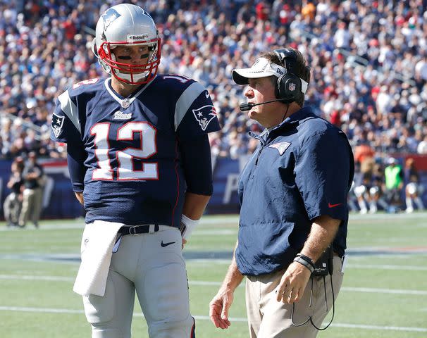 <p>Jim Rogash/Getty</p> Tom Brady and Bill Belichick in 2013