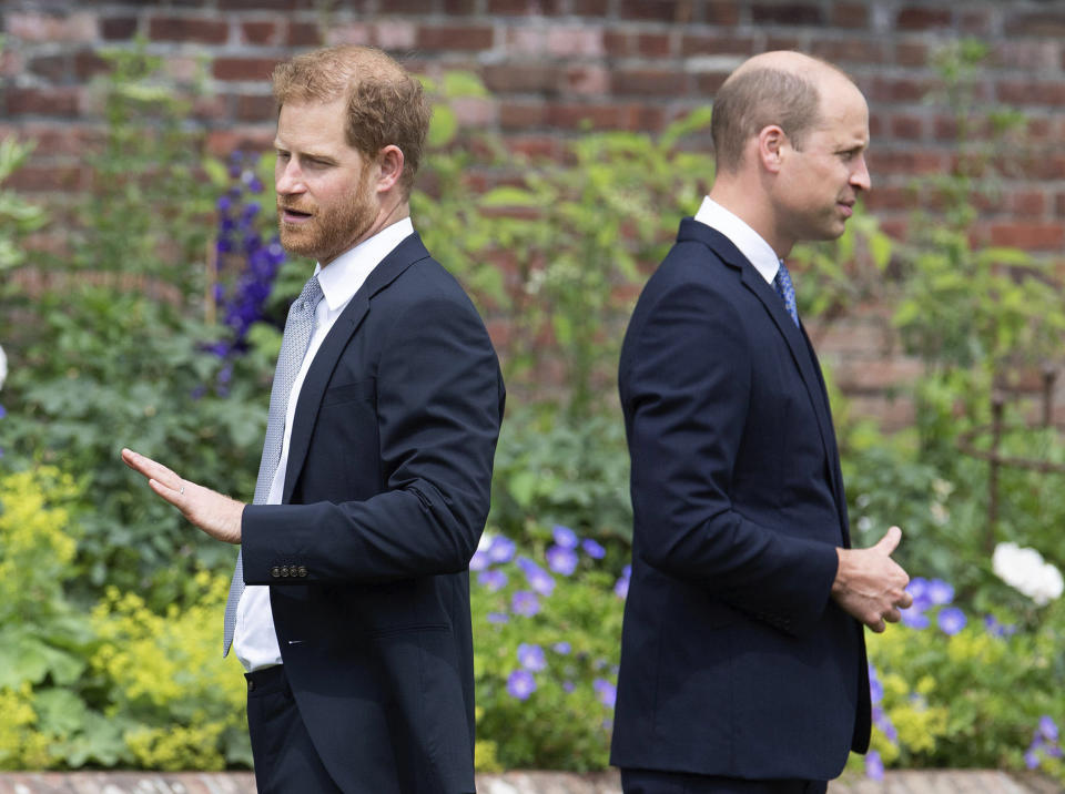 FILE - Prince Harry, left, and Prince William stand together during the unveiling of a statue they commissioned of their mother Princess Diana, on what would have been her 60th birthday, in the Sunken Garden at Kensington Palace, London, Thursday July 1, 2021. Prince Harry has said he wants to have his father and brother back and that he wants “a family, not an institution,” during a TV interview ahead of the publication of his memoir. The interview with Britain’s ITV channel is due to be released this Sunday. (Dominic Lipinski /Pool Photo via AP, File)