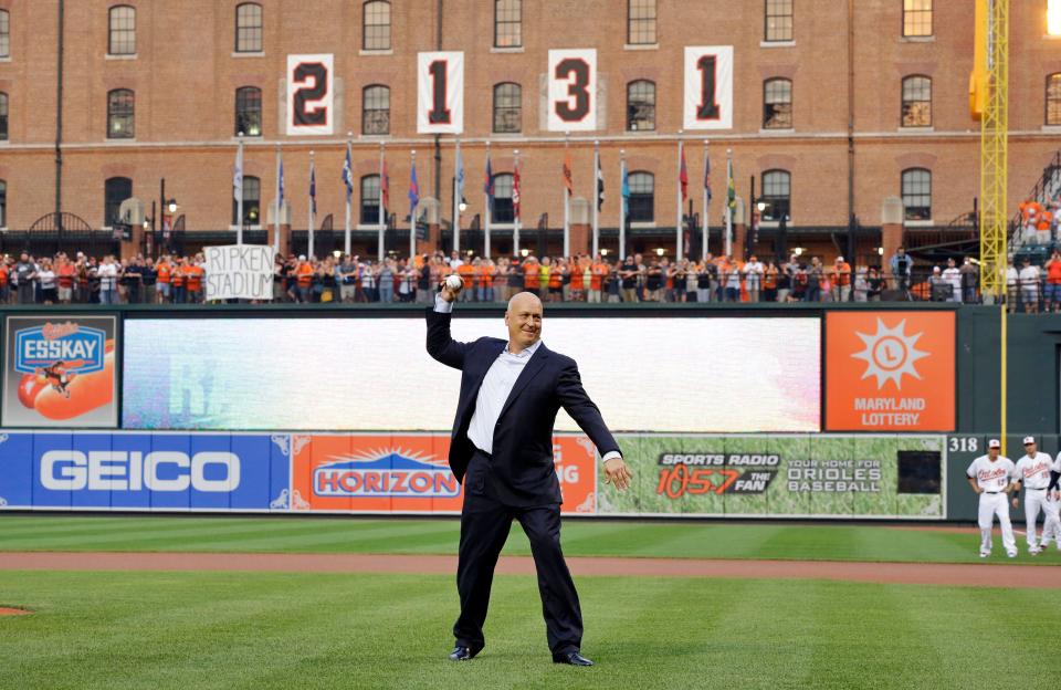 Former Baltimore Oriole Cal Ripken, Jr., throws out the ceremonial first pitch to mark the twentieth anniversary of his streak of 2,131 straight games before a baseball game between the Orioles and the Tampa Bay Rays, Tuesday, Sept. 1, 2015, in Baltimore. (AP Photo/Patrick Semansky)