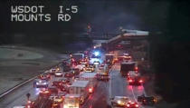 <p>A still image from a video camera shows an Amtrak train that derailed on a bridge over a highway in Pierce County, Washington state, U.S., December 18, 2017. (Photo: WSDOT via REUTERS) </p>