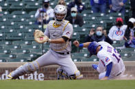 Chicago Cubs' David Bote (13) scores past Pittsburgh Pirates catcher Jacob Stallings, on a single by Joc Pederson, during the second inning of a baseball game Friday, May 7, 2021, in Chicago. (AP Photo/Charles Rex Arbogast)