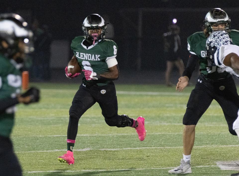 GlenOak’s Avantae Burt runs the ball against Lorain on Friday, Oct. 27, 2023.