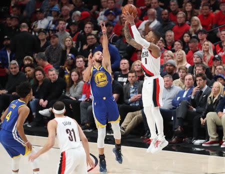 May 20, 2019; Portland, OR, USA; Golden State Warriors guard Stephen Curry (30) defends Portland Trail Blazers guard Damian Lillard (0) in the second half of game four of the Western conference finals of the 2019 NBA Playoffs at Moda Center. Mandatory Credit: Jaime Valdez-USA TODAY Sports