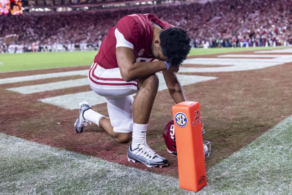 FILE - Alabama quarterback Bryce Young (9) kneels in the end zone seconds before kickoff before the first half of an NCAA college football game against Texas A&M, Saturday, Oct. 8, 2022, in Tuscaloosa, Ala. Young was selected the biggest injury in the Associated Press SEC Midseason Awards, Wednesday, Oct. 12, 2022. (AP Photo/Vasha Hunt, File)