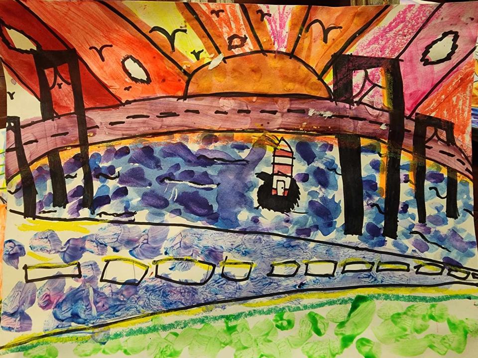 Melville Elementary School third grader Gwendolyn Montalvo depicts the sun coming up over the Newport Bridge.