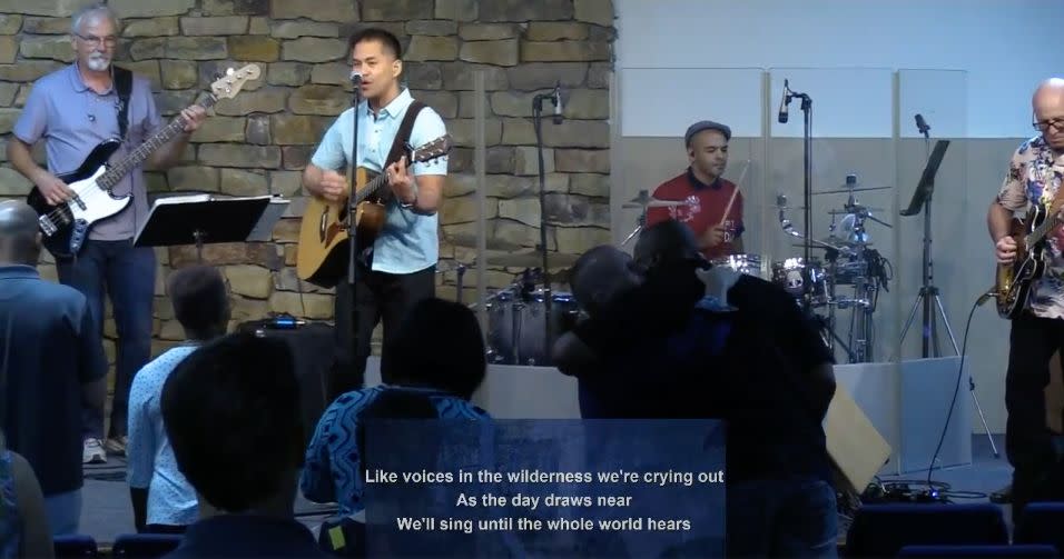 Pastor Ron Arbaugh can be spotted hugging an attendee in this screenshot from a June 21 service at Calvary Chapel of San Antonio. (Photo: Calvary Chapel San Antonio / Vimeo / Screenshot)