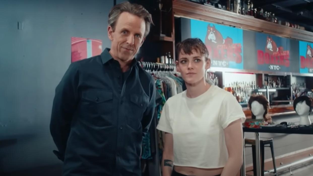  A screenshot of Seth Meyers and Kristen Stewart standing side by side and talking to the camera in Day Drinking. 