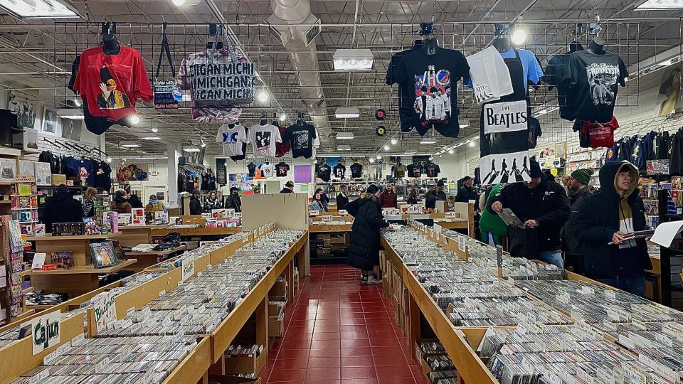 Customers line up inside Dearborn Music to receive the exclusive music titles and merchandise marked on their wish lists for the 16th annual Record Store Day on Saturday, April 20, 2024.