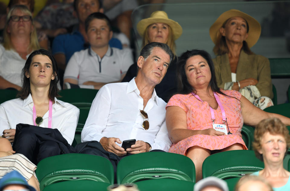 LONDON, ENGLAND - JULY 13:  Dylan Brosnan, Pierce Brosnan and Keely Shaye Smith attend day eleven of the Wimbledon Tennis Championships at the All England Lawn Tennis and Croquet Club on July 13, 2018 in London, England.  (Photo by Karwai Tang/WireImage )