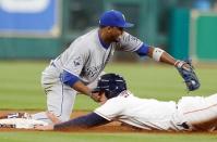 Apr 14, 2016; Houston, TX, USA; Houston Astros right fielder George Springer (4) is forced out by Kansas City Royals shortstop Alcides Escobar (2) at second base in the seventh inning at Minute Maid Park. Thomas B. Shea-USA TODAY Sports