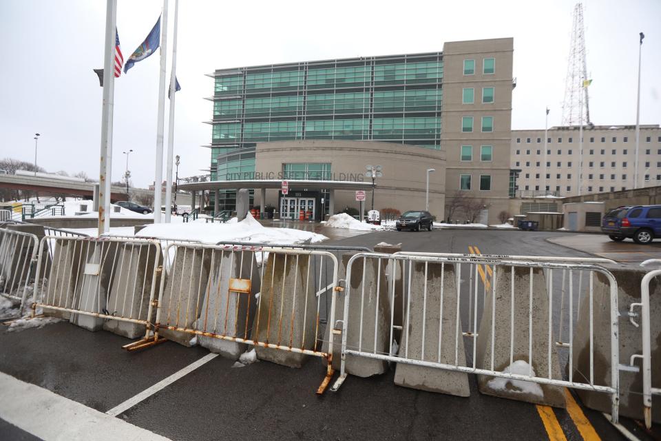 The Public Safety Building, home to the Rochester Police Department has cement barriers as well as metal gates around their building on February 23, 2021.