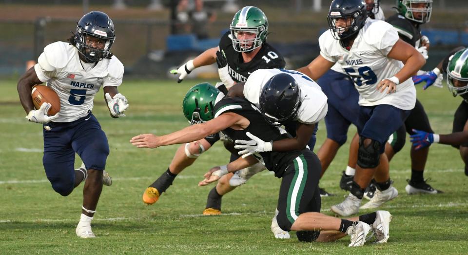 Naples running back Shawn Simeon (#5) rushed the ball 22 times for 216 yards and two touchdowns. Spring football was back a Venice hosted the Naples Golden Eagles at Venice's Powell-Davis Stadium Tuesday evening May 21, 2024.