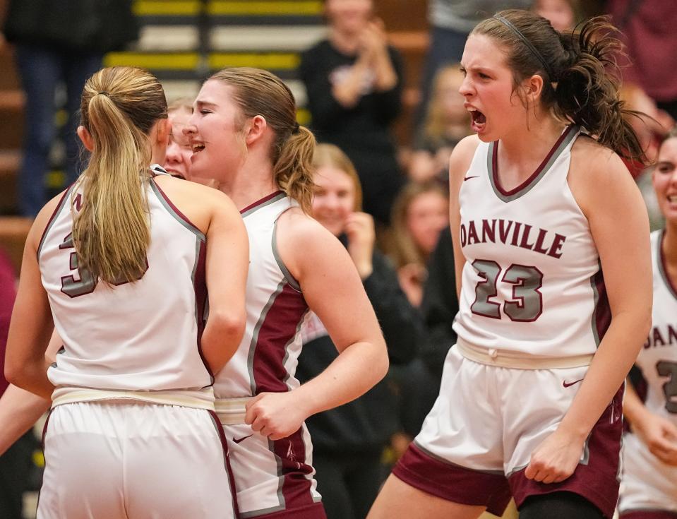 Danville's Alexis Lynch (23) yells in excitement with Danville's guard Emma Ancelet (33) on Saturday, Jan. 6, 2024, during the game at Danville Community High School in Danville.