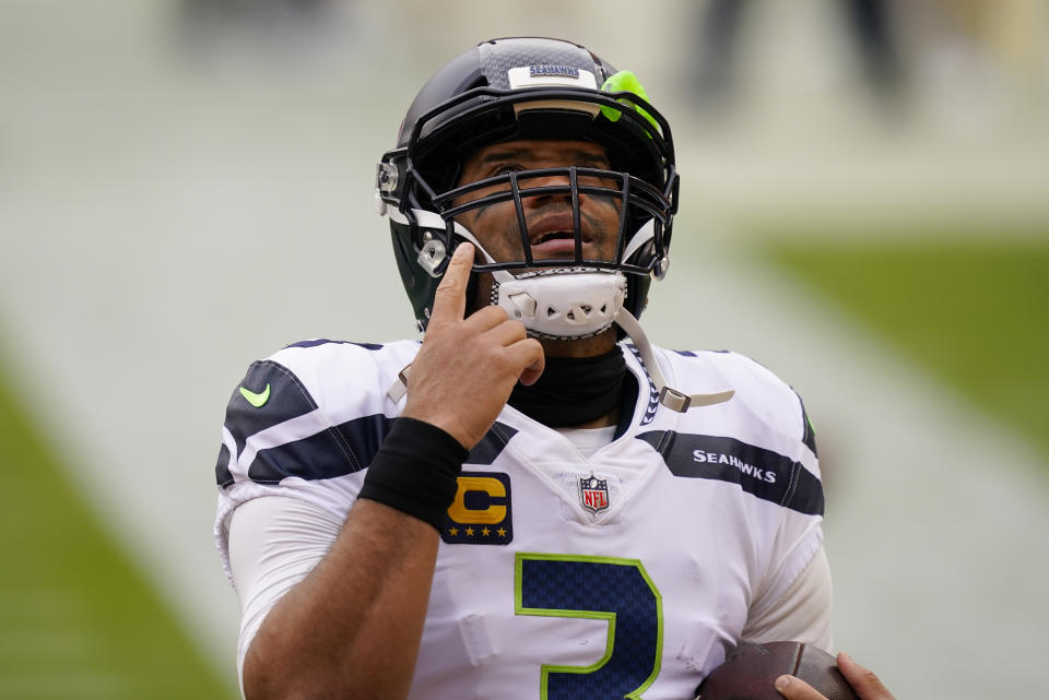 Seattle Seahawks quarterback Russell Wilson (3) points upwards before the start of the first half of an NFL football game against the Washington Football Team, Sunday, Dec. 20, 2020, in Landover, Md. (AP Photo/Andrew Harnik)