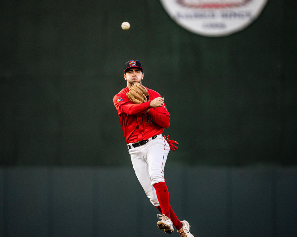 Sea Dogs shortstop Marcelo Mayer fires a ball in the infield.