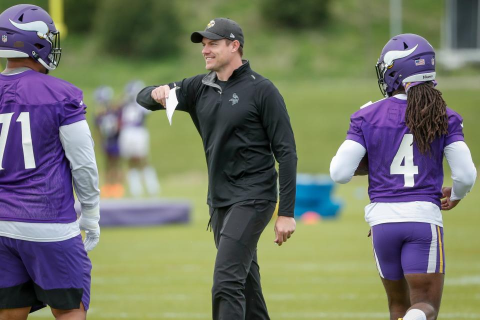 Minnesota Vikings head coach Kevin O'Connell directs his team in drills at the NFL football team's practice facility in Eagan, Minn., Tuesday, May 17, 2022.