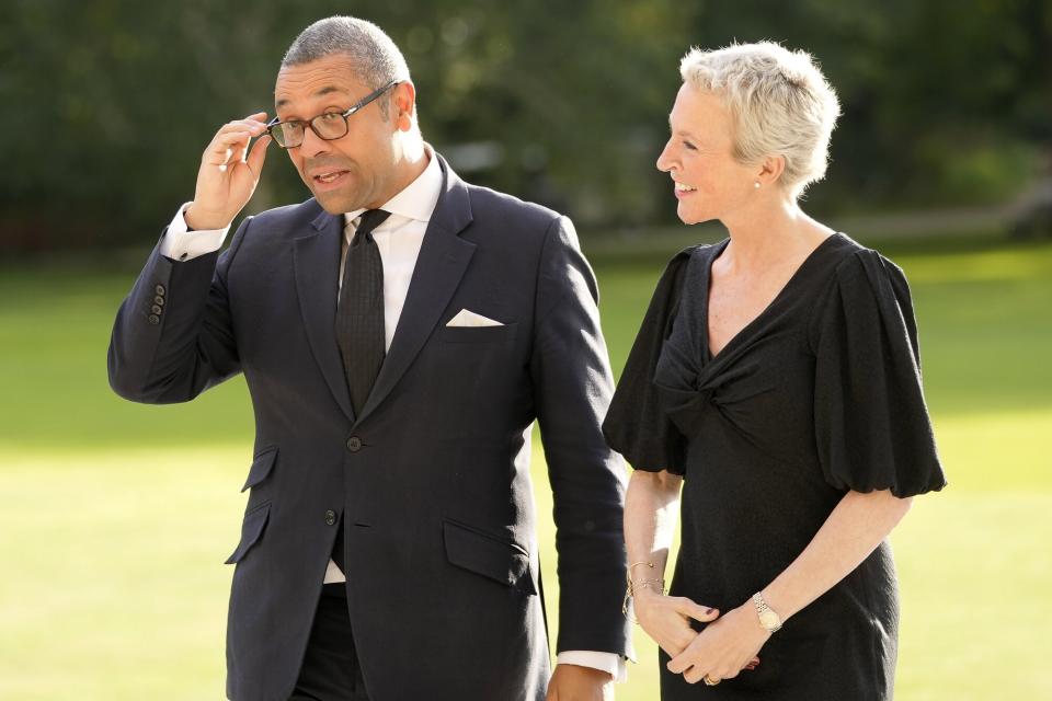 Britain's Foreign Secretary James Cleverly, left, arrives at Buckingham Palace for a State Reception For Heads Of State on September 18, 2022 in London, England. Tonight's state reception is for Heads of State and visiting overseas guests who will attend tomorrow's state funeral for Queen Elizabeth II.