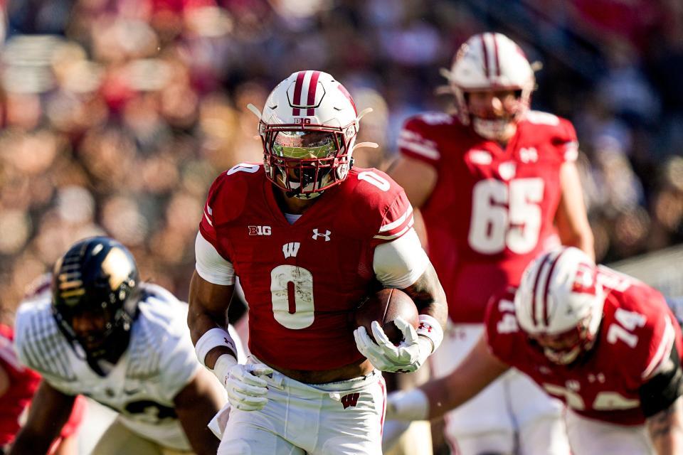 Wisconsin running back Braelon Allen runs for a first down against Purdue during the first half of an NCAA college football game Saturday, Oct. 22, 2022, in Madison, Wis. (AP Photo/Andy Manis)