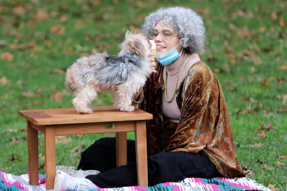 <p>Kate McKinnon wears a grey wig and feeds ice cream to a furry friend while filming a skit for<i> Saturday Night Live</i> on Tuesday in N.Y.C. </p>