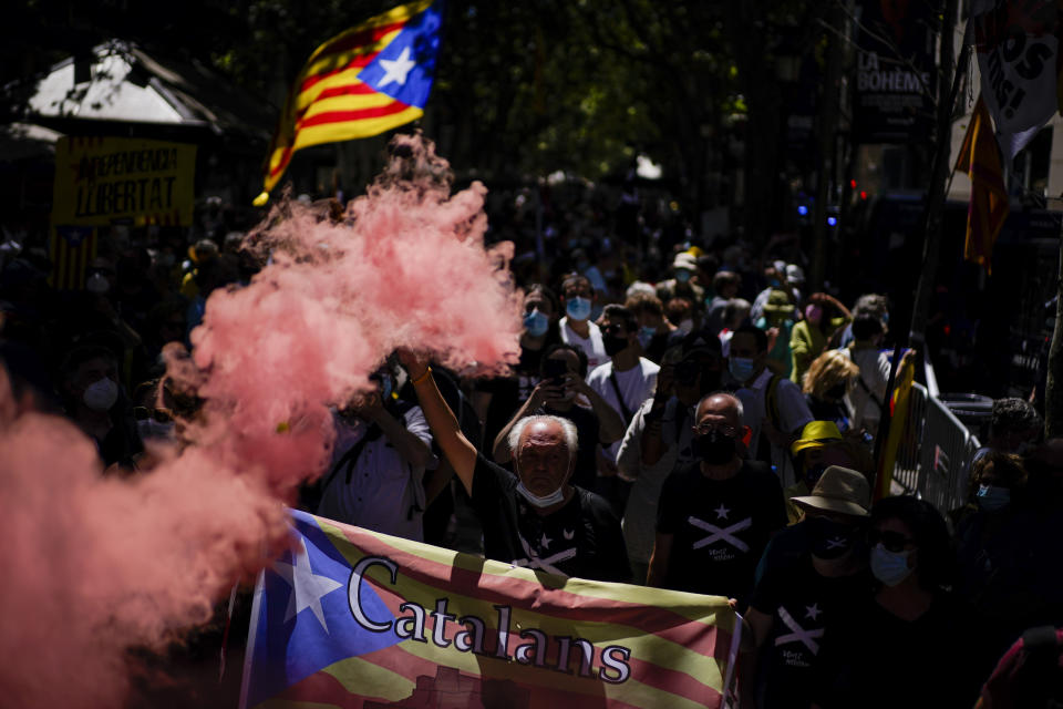 Pro-independence demonstrators gather during a protest against Spain's prime minister Pedro Sanchez outside the Gran Teatre del Liceu in Barcelona, Spain, Monday, June 21, 2021. Sanchez's said Monday that the Spanish Cabinet will approve pardons for nine separatist Catalan politicians and activists imprisoned for their roles in the 2017 push to break away from Spain. (AP Photo/Joan Mateu)