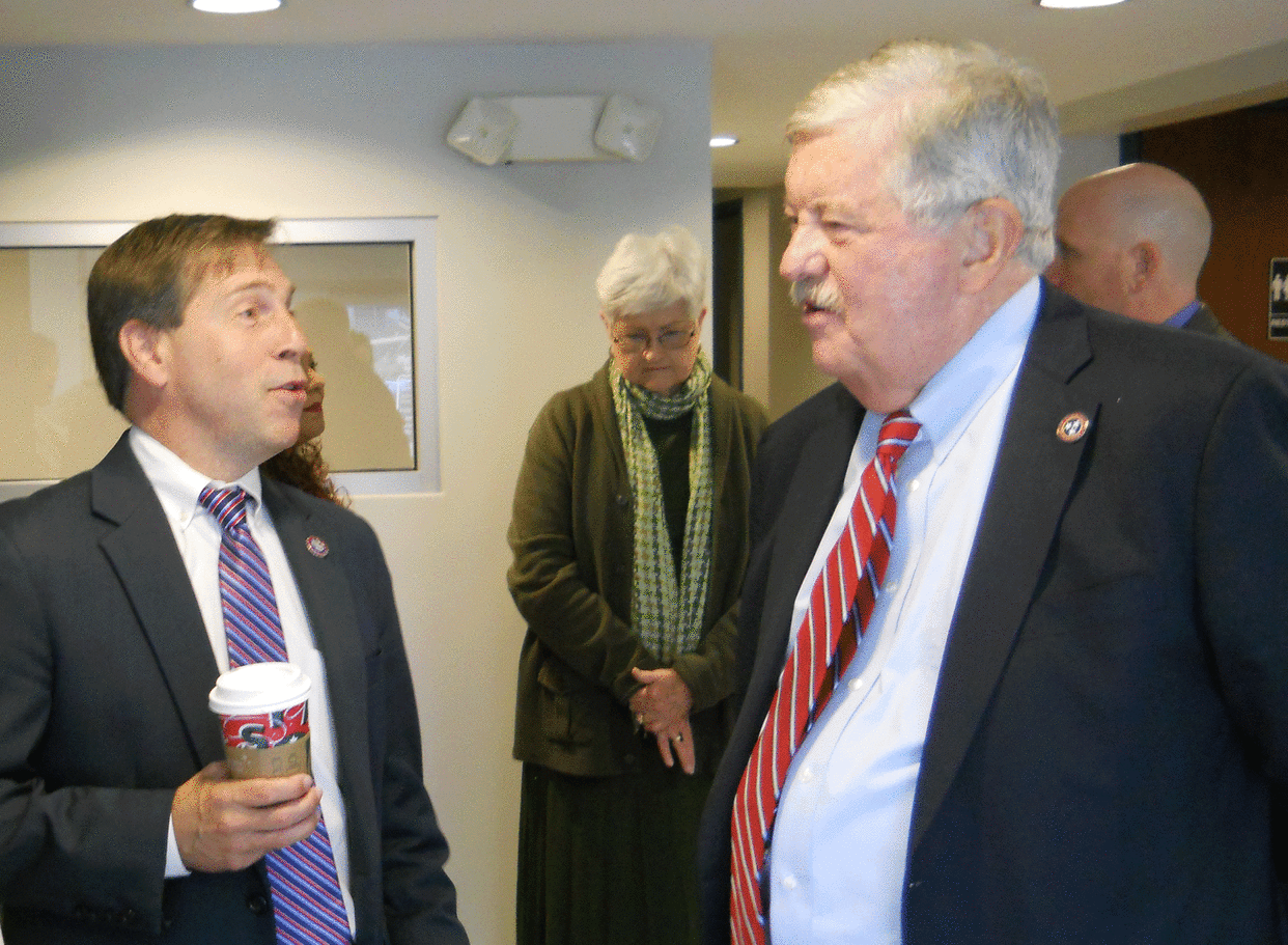 U.S. Congressman Chuck Fleischmann, R-Third District, left, talks to Lt. Gov. Randy McNally in Oak Ridge before a ceremony in which a check was presented to the Oak Ridge Housing Authority. In the background is Jean Lantrip, Oak Ridge Housing Authority board chair.