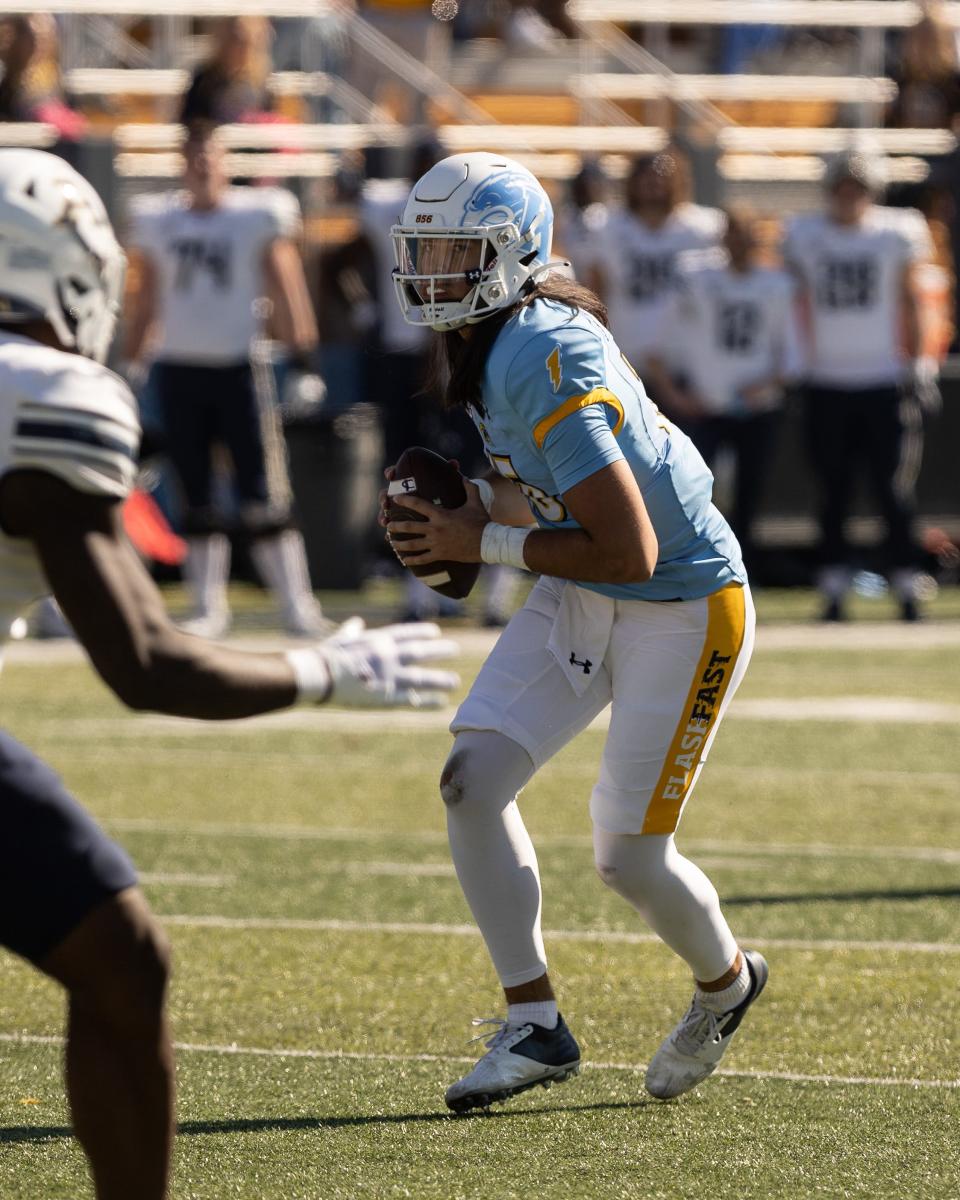 Kent State quarterback Devin Kargman handles the ball in the first half of Saturday’s game against the Akron Zips.