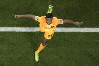 Denzel Dumfries of the Netherlands celebrates after scoring his side's third goal during the World Cup round of 16 soccer match between the Netherlands and the United States, at the Khalifa International Stadium in Doha, Qatar, Saturday, Dec. 3, 2022. (AP Photo/Hassan Ammar)