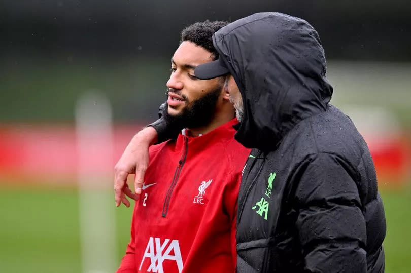 Joe Gomez speaks to Jurgen Klopp during Liverpool training