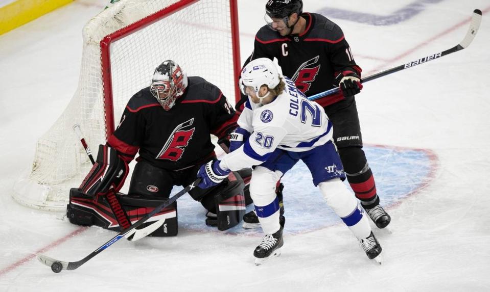 Tampa Bays Blake Coleman (21) tries to score on Carolina Hurricanes goalie Petr Mrazek (34) during the first period on Thursday, January 28, 2021 at PNC Arena in Raleigh, N.C.
