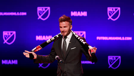 FILE PHOTO: David Beckham, wearing a league scarf, speaks at this official announcement for Miami's MLS expansion team in Miami, Florida, U.S. January 29, 2018. REUTERS/Andrew Innerarity -/File Photo