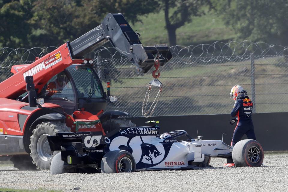 Red Bull's Dutch driver Max Verstappen (R) walks past AlphaTauri's French driver Pierre Gasly after both crash during the Tuscany Formula One Grand Prix at the Mugello circuit in Scarperia e San Piero on September 13, 2020. (Photo by Luca Bruno / POOL / AFP) (Photo by LUCA BRUNO/POOL/AFP via Getty Images)