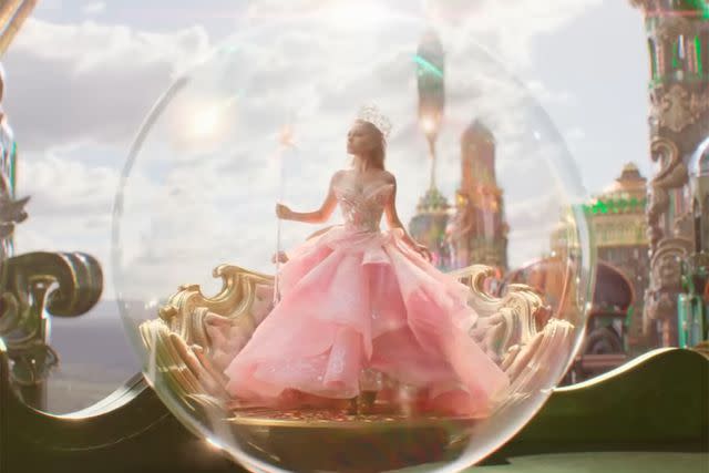 <p>Universal Pictures</p> Ariana Grande as Glinda in the 'Wicked' trailer