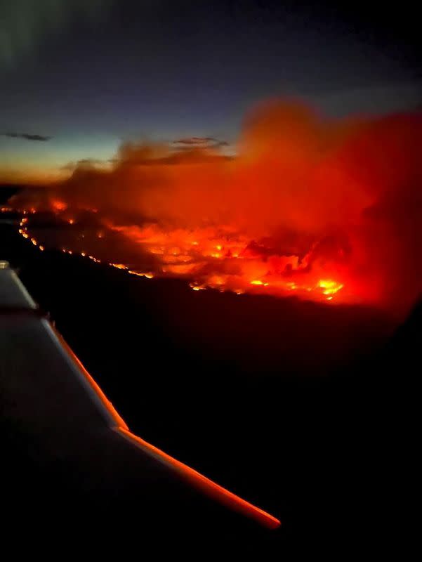 The Parker Lake wildfire glows in an aerial photograph taken by a B.C. Emergency Health Services crew member