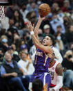 Phoenix Suns guard Devin Booker shoots against the Portland Trail Blazers during the second half of an NBA basketball game in Portland, Ore., Saturday, Oct. 23, 2021. (AP Photo/Craig Mitchelldyer)