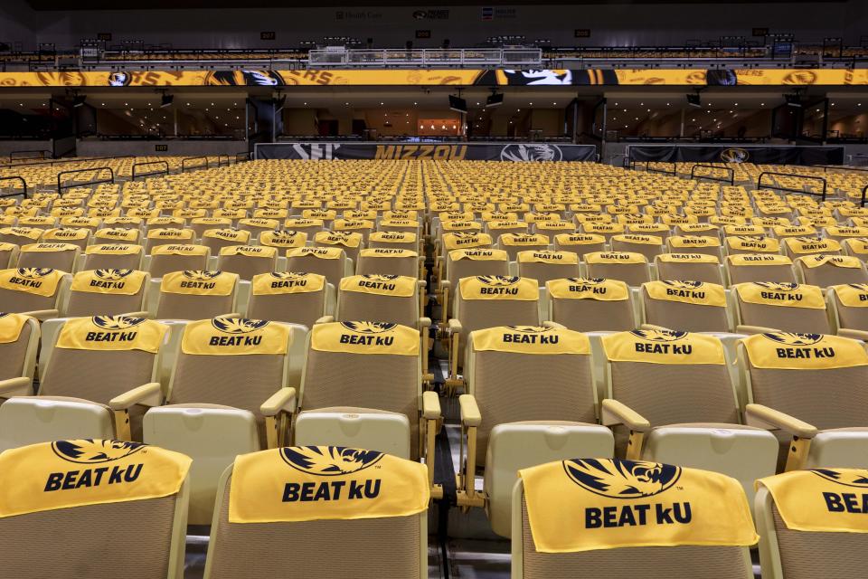 Towels for fans sit on the seats at Mizzou Arena before the start of an NCAA college basketball game against Kansas Saturday, Dec. 10, 2022, in Columbia, Mo. (AP Photo/L.G. Patterson)