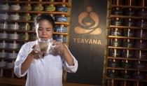 Teavana's director of tea development Naoko Tsunoda smells a cup of tea as she poses for a portrait at a Teavana store in New York, October 23, 2013. REUTERS/Carlo Allegri