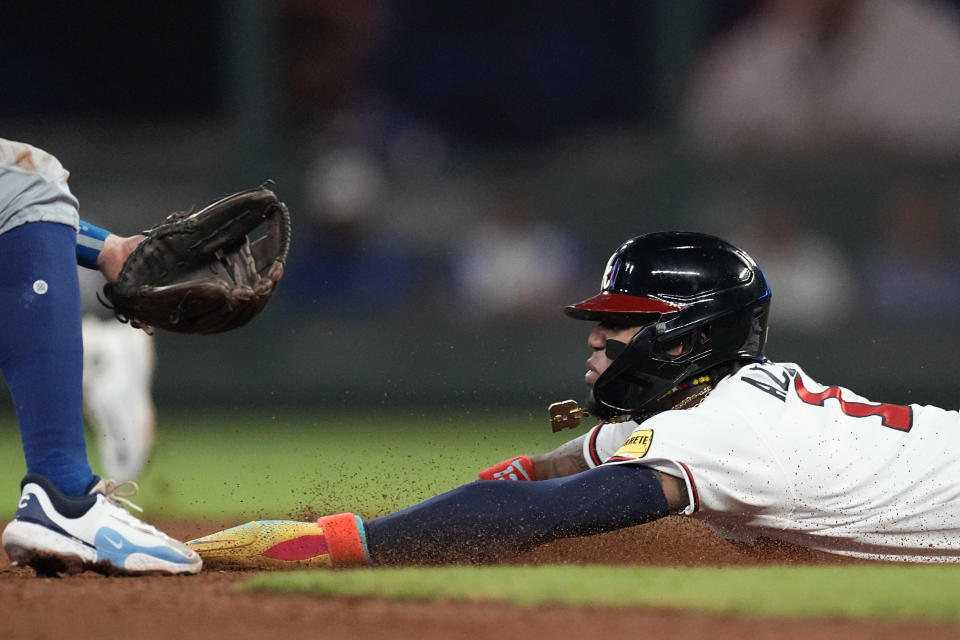 APTOPIX Atlanta Braves' Ronald Acuna Jr. (13) steals second base in the 10th inning of a baseball game against the Chicago Cubs, Wednesday, Sept. 27, 2023, in Atlanta. The stolen base was Acuna's 70th of the season. (AP Photo/John Bazemore)