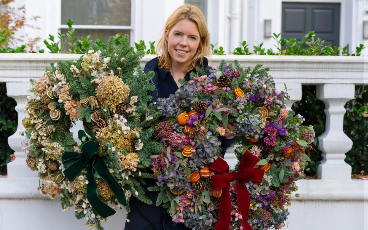 Lucy Vail with a wreath