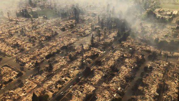 This aerial photo provided by the California Highway Patrol shows some of hundreds of homes destroyed in Santa Rosa.