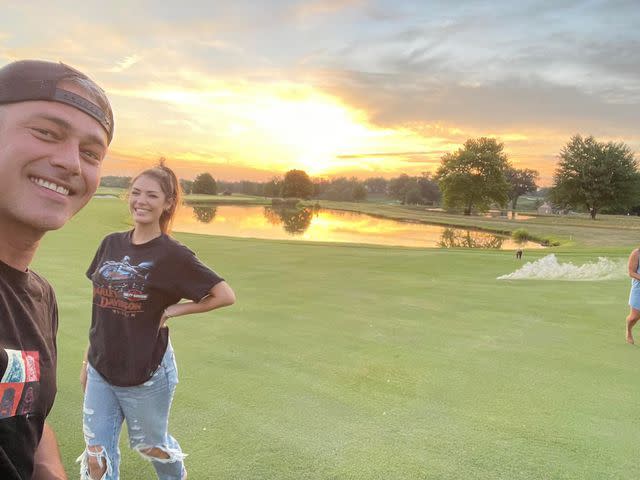 <p>Taylor Kinney Instagram</p> Taylor Kinney and Ashley Cruger take a selfie on a golf course