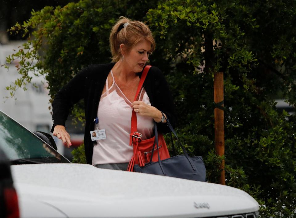 Cape Coral council member Patty Cummings makes her way to City Hall to participate in the council meeting Wednesday, Nov. 15, 2023. After an ongoing investigation by the State AttorneyÕs Office Cummings turned herself in to authorities on Tuesday, Nov. 14, 2023 after being charged with three felonies.