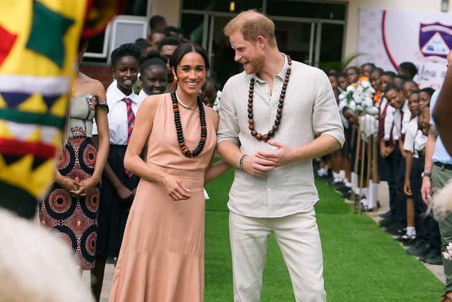 <p>AP Photo/Sunday Alamba</p> Meghan Markle and Prince Harry at Lightway Academy in Abuja, Nigeria, on May 10, 2024.