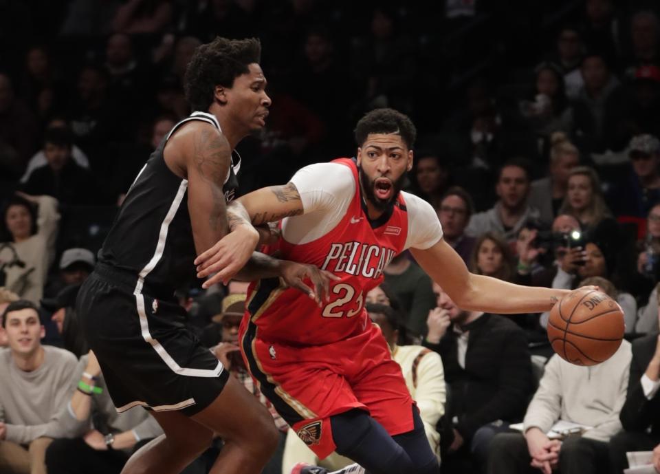 Anthony Davis drives against the Nets’ Ed Davis during an early January game. (AP)