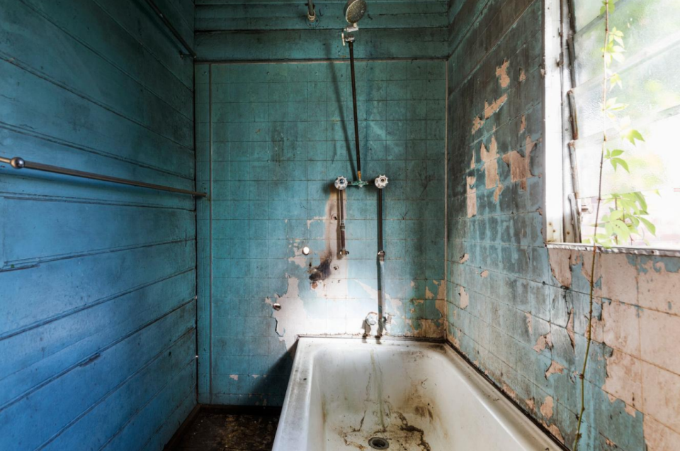 Forget modern, clean lines, the bathroom is all about tatty blue tiles. Photo: www.realestate.com.au