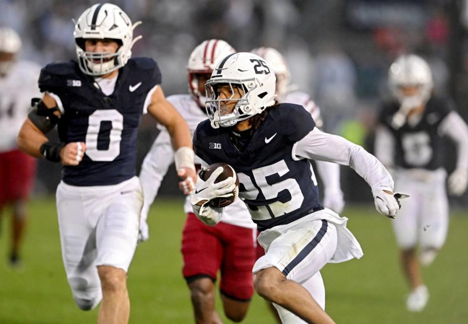 Penn State cornerback Daequan Hardy returns a punt for a touchdown during the game against UMass on Saturday, Oct. 14, 2023.