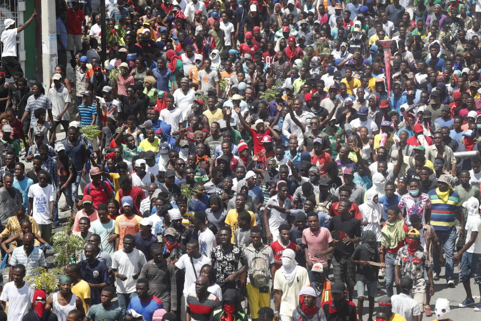 Haitians gather for a nationwide push to block streets and paralyze the country's economy as they press for President Jovenel Moise to give up power, in Port-au-Prince, Haiti, Monday, Sept. 30, 2019. Opposition leaders and supporters say they are angry about public corruption, spiraling inflation and a dwindling supply of gasoline that has forced many gas stations in the capital to close as suppliers demand the cash-strapped government pay them more than $100 million owed. (AP Photo/Rebecca Blackwell)