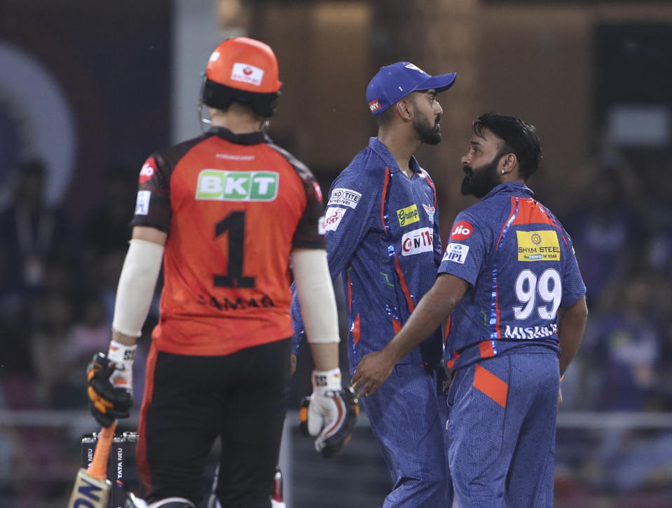 Amit Mishra of Lucknow Super Giants talks with captain KL Rahul as Abdul Samad of Sunrisers Hyderabad walks to bat during the Indian Premier League cricket match in Lucknow, India, Friday, April 7, 2023. (AP Photo/Surjeet Yadav)