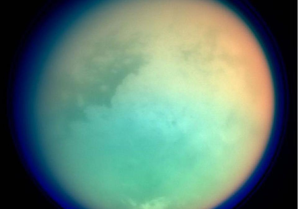 This undated NASA handout shows Saturn's moon, Titan, in ultraviolet and infrared wavelengths: NASA via Getty Images