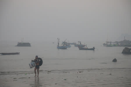 A fisherman return from a morning haul in Ngapali beach in Thandwe, Rakhine, Myanmar February 20, 2019. REUTERS/Ann Wang