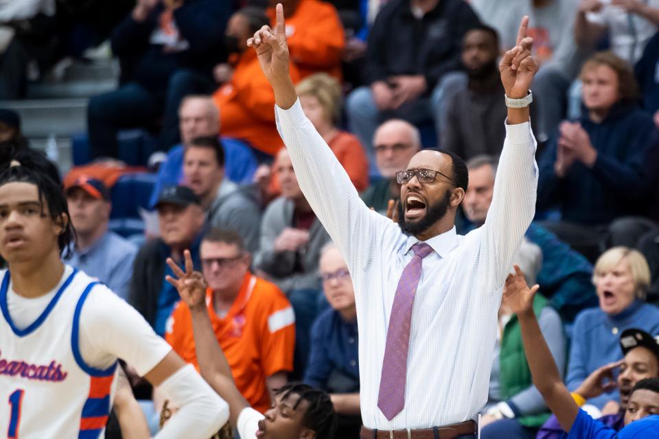 York High head coach Clovis Gallon reacts after Juelz Tucker buries a corner three during a YAIAA boys' quarterfinal game against York Catholic at West York Area High School on Friday, February 10, 2023. The Bearcats won, 68-49.